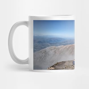 Climbers resting at the summit of Ben Nevis Mug